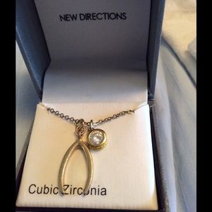 Cubic zirconia and gold colored necklace