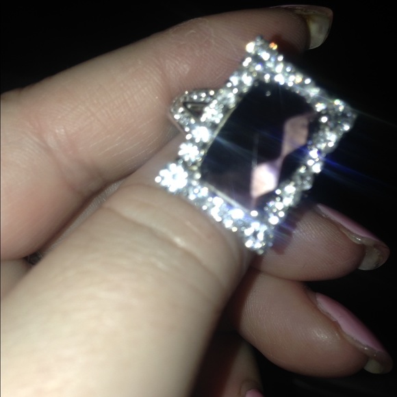 Sterling silver ring with center purple stone