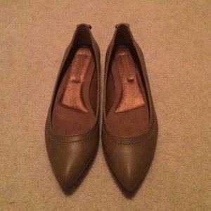 Tan Calvin Klein flats.
