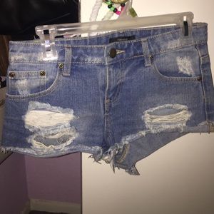 Mid waist ripped jean shorts. Good condition.