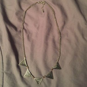 Silver triangle necklace.