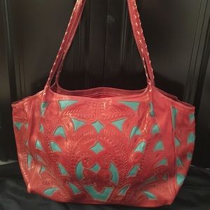 A beautiful leather red and turquoise shoulder bag
