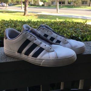 Adidas sneakers (I believe they're "Daily" shoes)!
