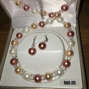 Brand new mother of pearl necklace set.