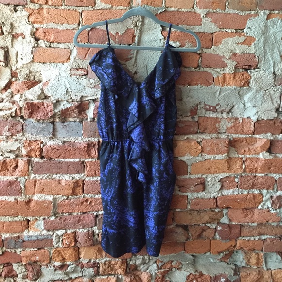 Black cocktail dress with ruffles and pockets