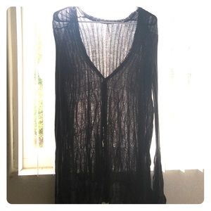 Free People sheer charcoal button-up sweater.