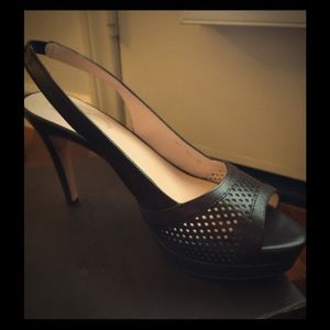 Sling heels that have a brownish wine hue