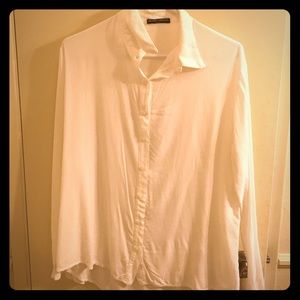 Brandy Melville sheer white button down blouse.