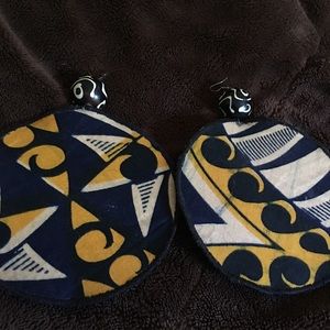 Yellow, black and white patterned earring.