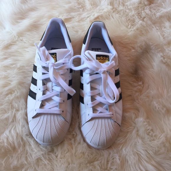 Adidas Superstars.