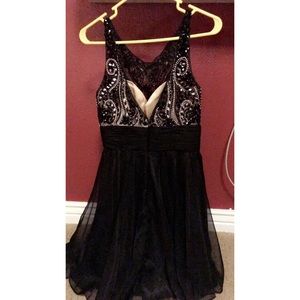Wore once, all black, backless covered in diamonds