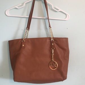 Tan leather Michael Kors purse.