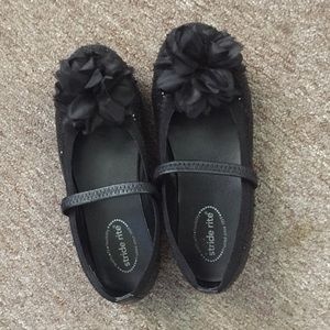 Black ballet flats with flower on top