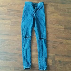 Knee cut jeans.