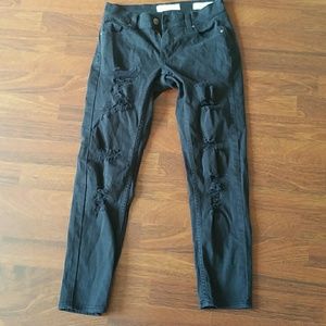 Black ripped boyfriend jeans.
