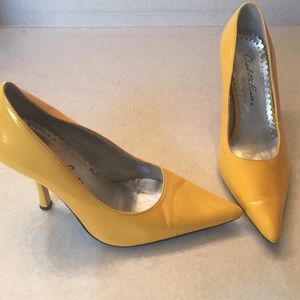 Bright yellow, pointed toe heels