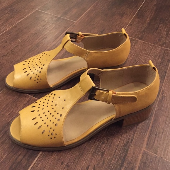 Size 10 yellow shoes from urban outfitters .