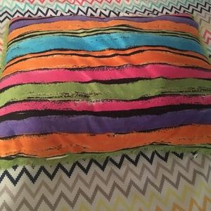A green and colorful pillow