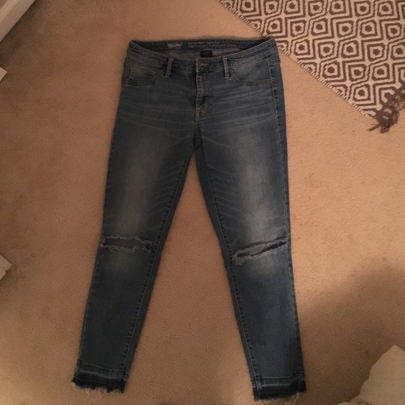 Jean capris with holes at the knees