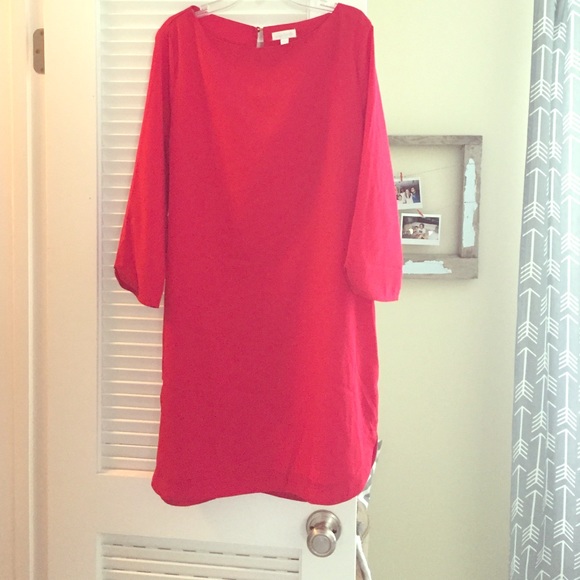 Red dress with 3/4 sleeves.