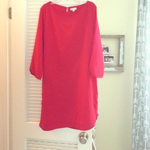 Red dress with 3/4 sleeves.