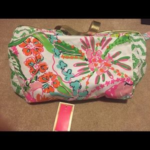 Used but tag on Lilly tote. Couple stains.