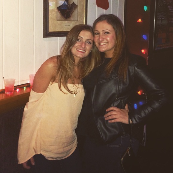 The peach shirt on the left