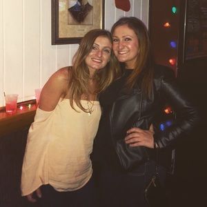 The peach shirt on the left