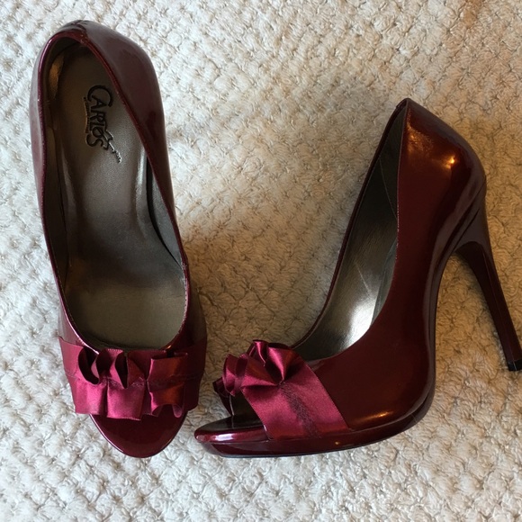 Carlos Santana ruby red heels satin toe detail