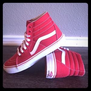 Red and white sk8 hi shoes. (Vans)
