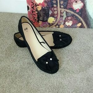 Black tassled moccasins