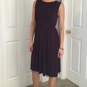 Plum, A-line, mid-length, ties in back.