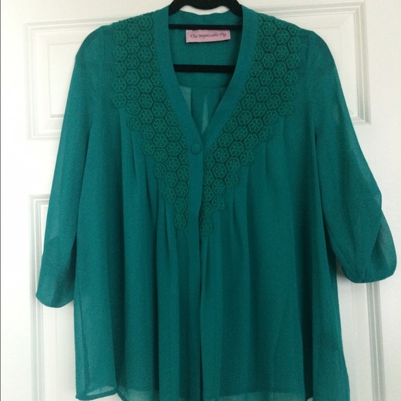 Turquoise flowy shirt with embroidered detail