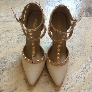 Nude stud high heels.