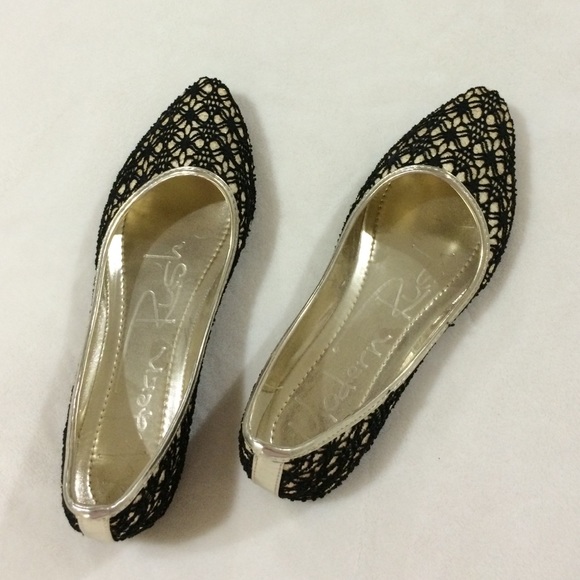 Darling black and gold flats.