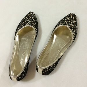 Darling black and gold flats.