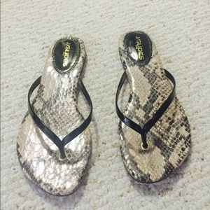 Black patent leather thing sandals.