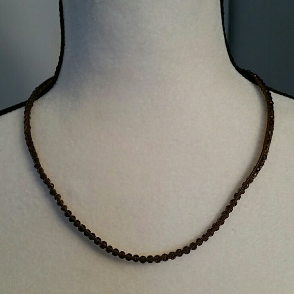 Purple crystal and brown corded necklace