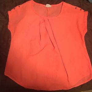 A coral blouse