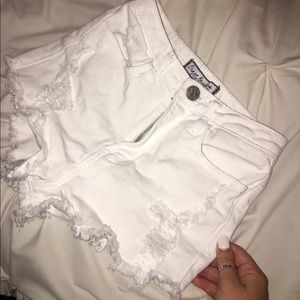 Distressed white high waisted shorts