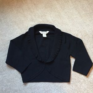Black shrug with scalloped collar
