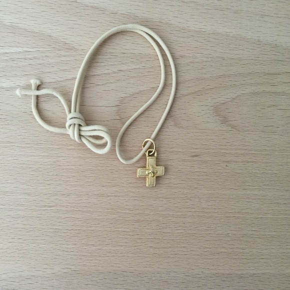 Vintage cross pendant on white choker necklace