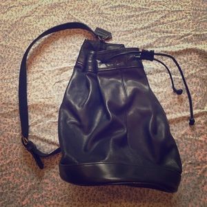Vintage Coach black sling drawstring shoulder bag.
