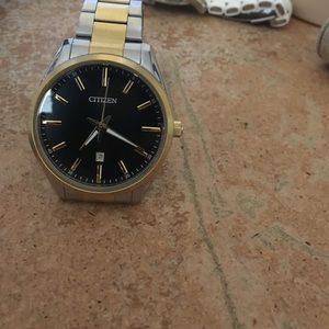 Black and gold citizen watch