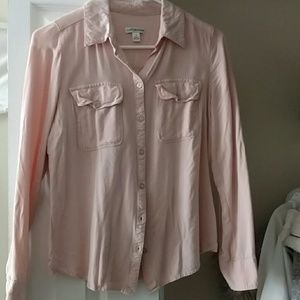 Blush pink button down shirt.