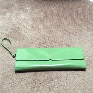 Albani green patten leather clutch