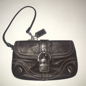Quintessential brown Coach wristlet