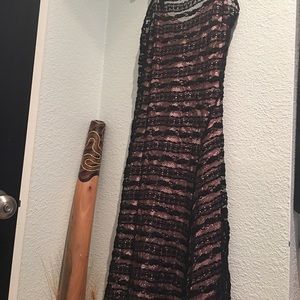 Black dress with pink undergarment from Italy.