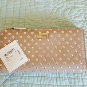 Bifold wallet nude in color with silver polka dots