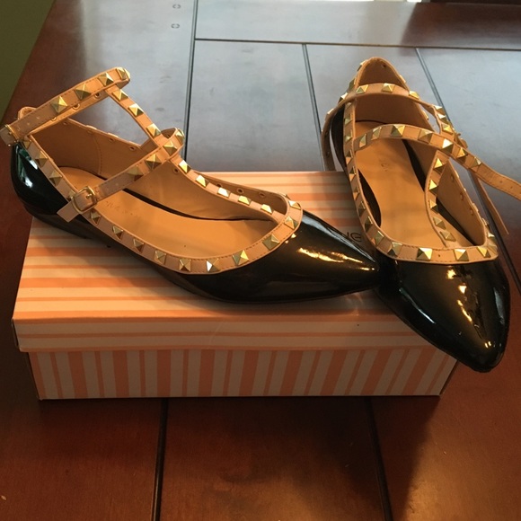 Black and nude flats with gold detailing